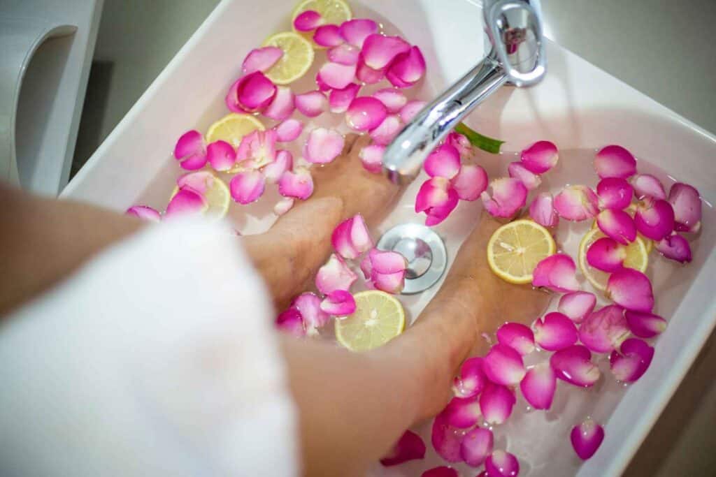 A man putting his feet in water tub