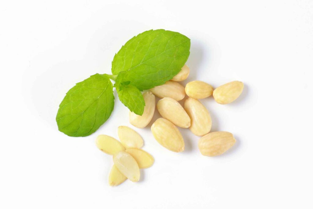 Blanched almond with almond leaves