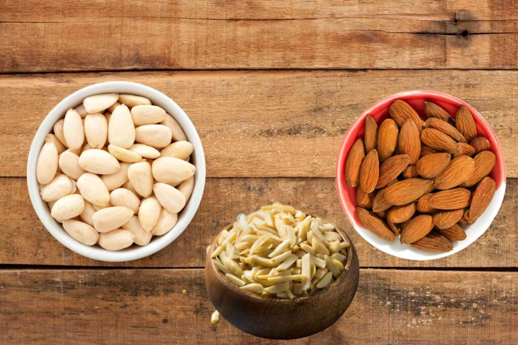 Raw, blanched, and slivered almonds on a table