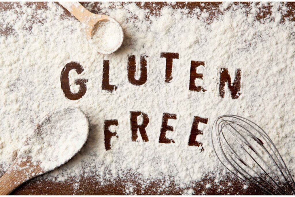 Gluten free written from flour on table