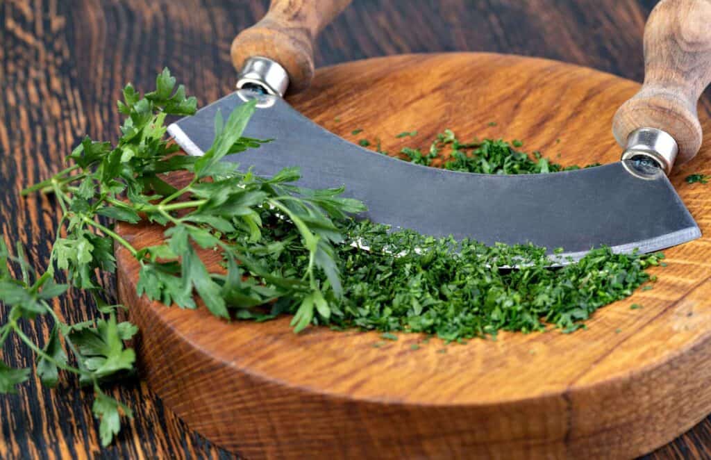 Parsely chopping on a wooden dice