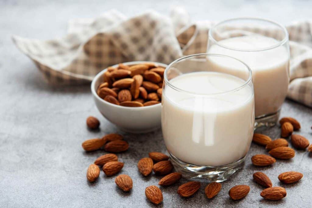 milk glass and bowl of almond