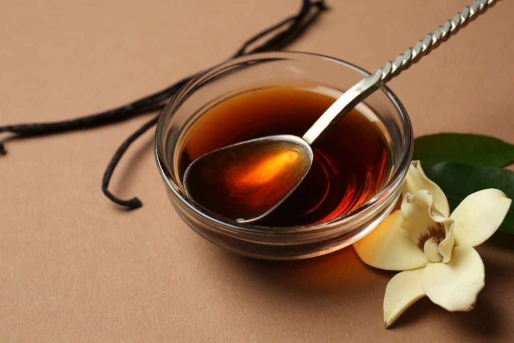 vanilla extract in a bowl with spoon in it