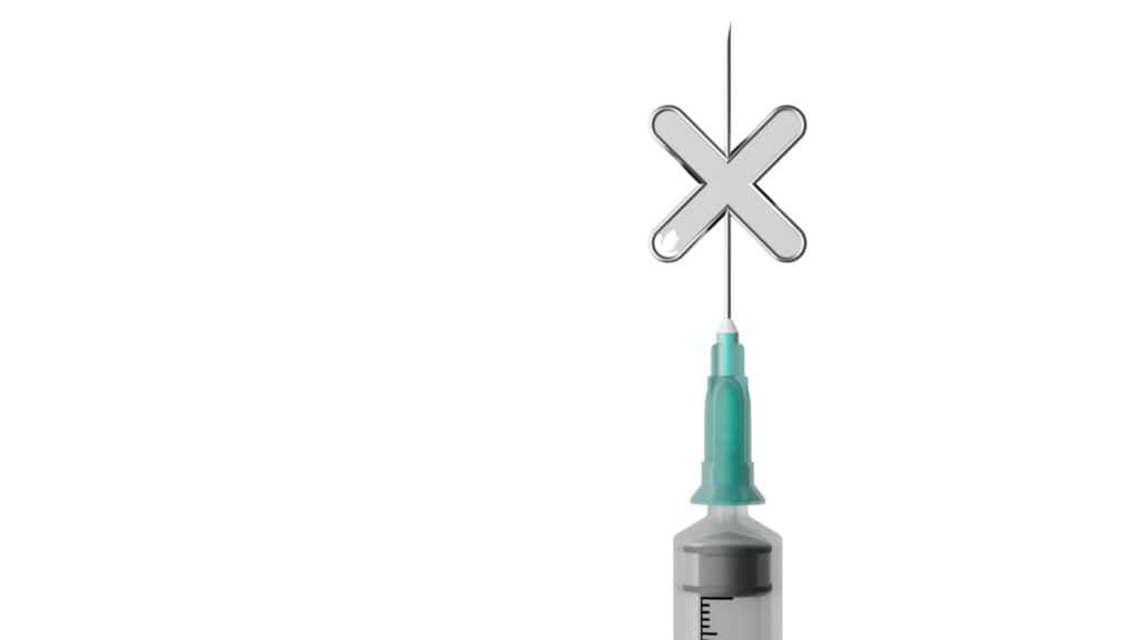 A syringe with needle and cross on it