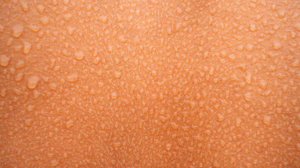 small water drops on skin of a person