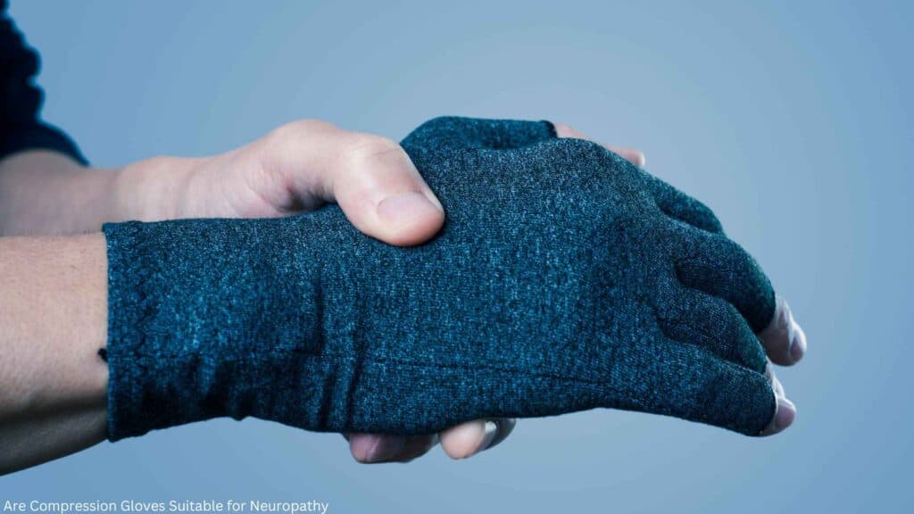 A man with compression gloves in one hand