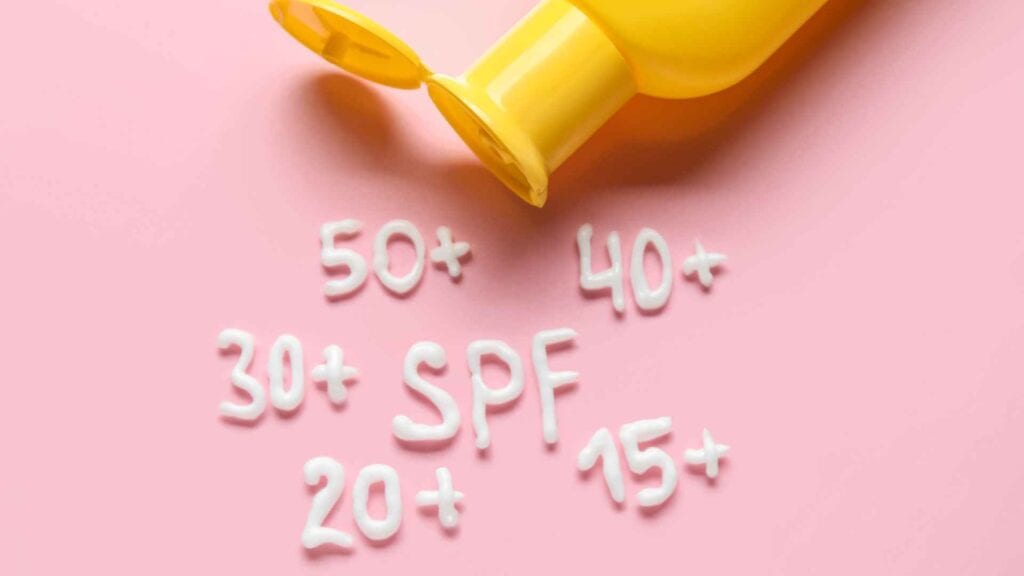 Sunscreen with spf values, pink background