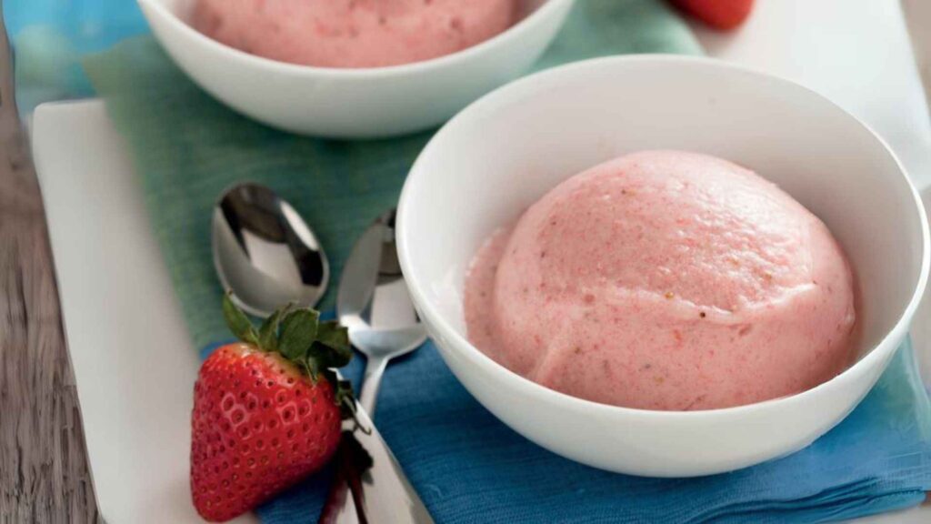 Strawberry Banana 'Ice Cream' in  bowl with  spoon and strawberry