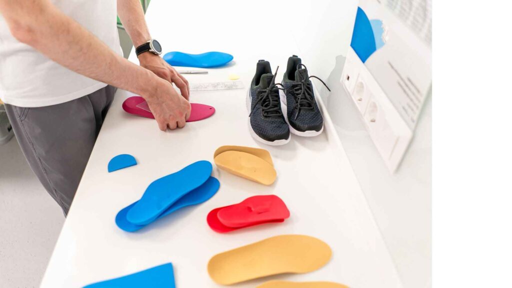 diiferent orthotics insoles on a table